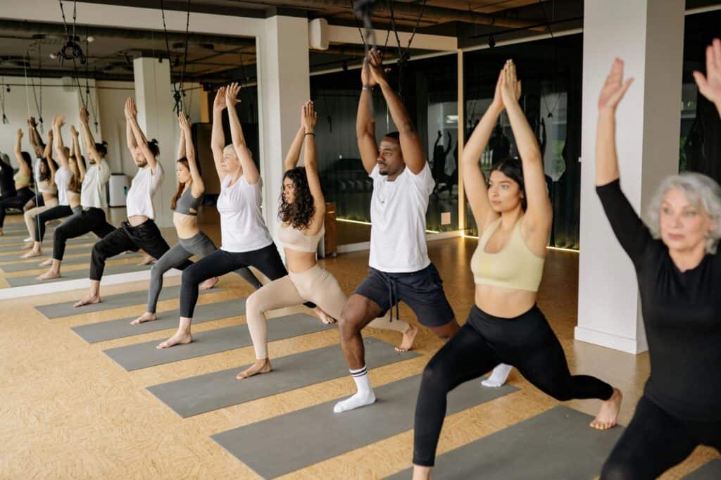 A group of people during a yoga class in a fitness centre