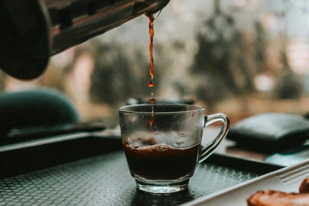 Coffee being poured into a cup